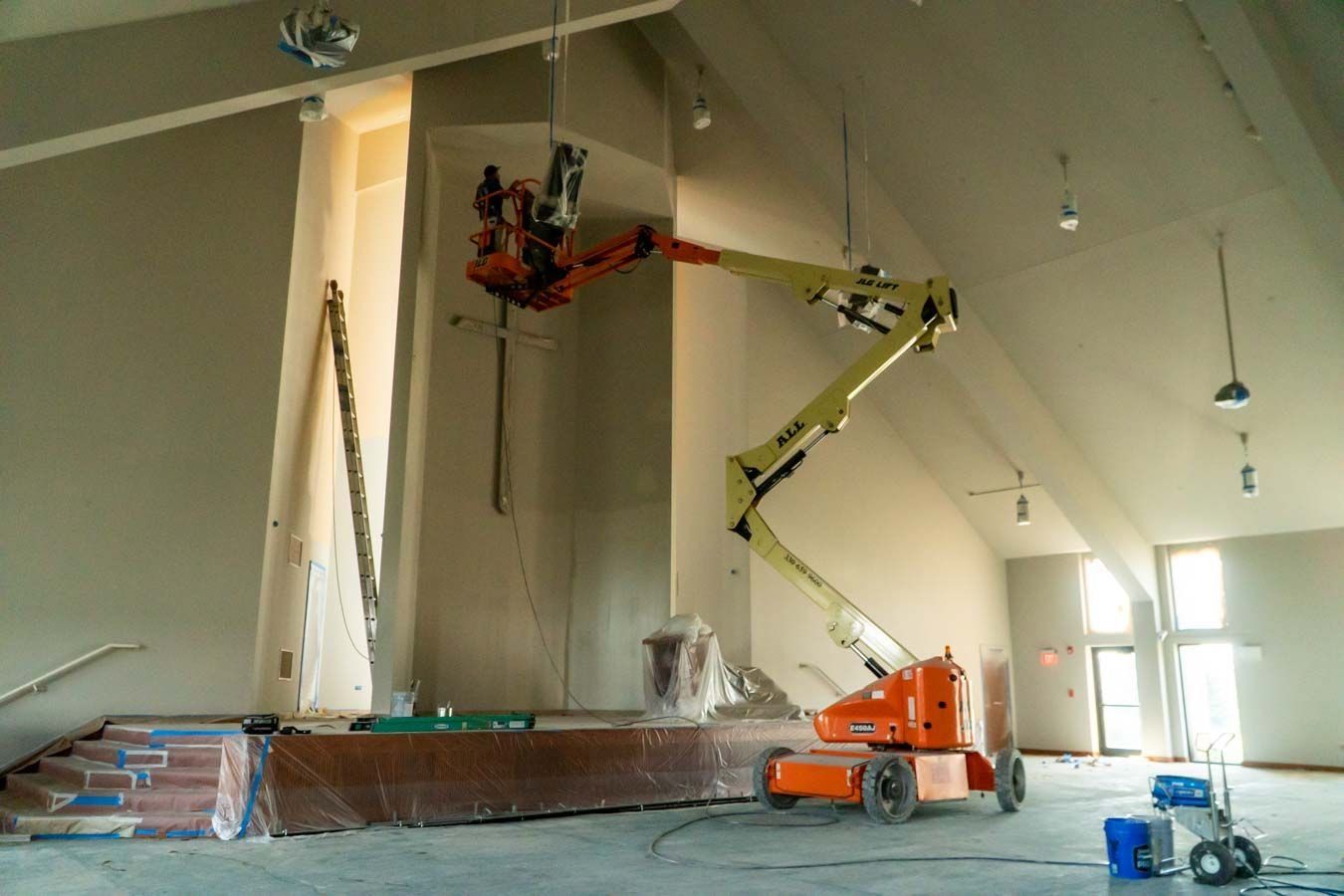 a large room with a crane in the middle of it .
