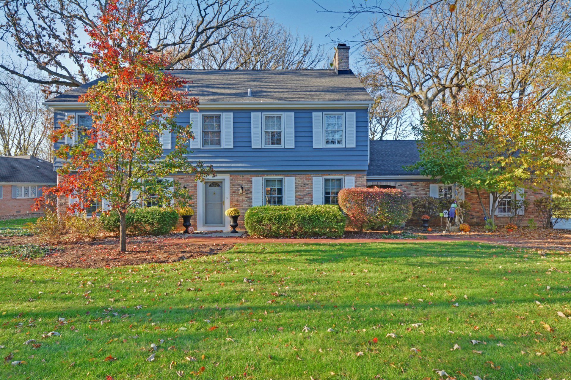 a large house with a large lawn in front of it