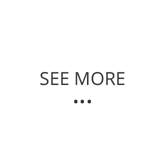 a white sign that says `` see more '' on a white background .