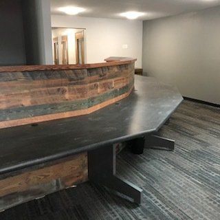 There is a large table in the middle of the room.