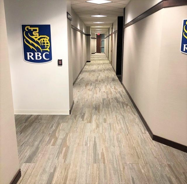 A long hallway with a rbc logo on the wall