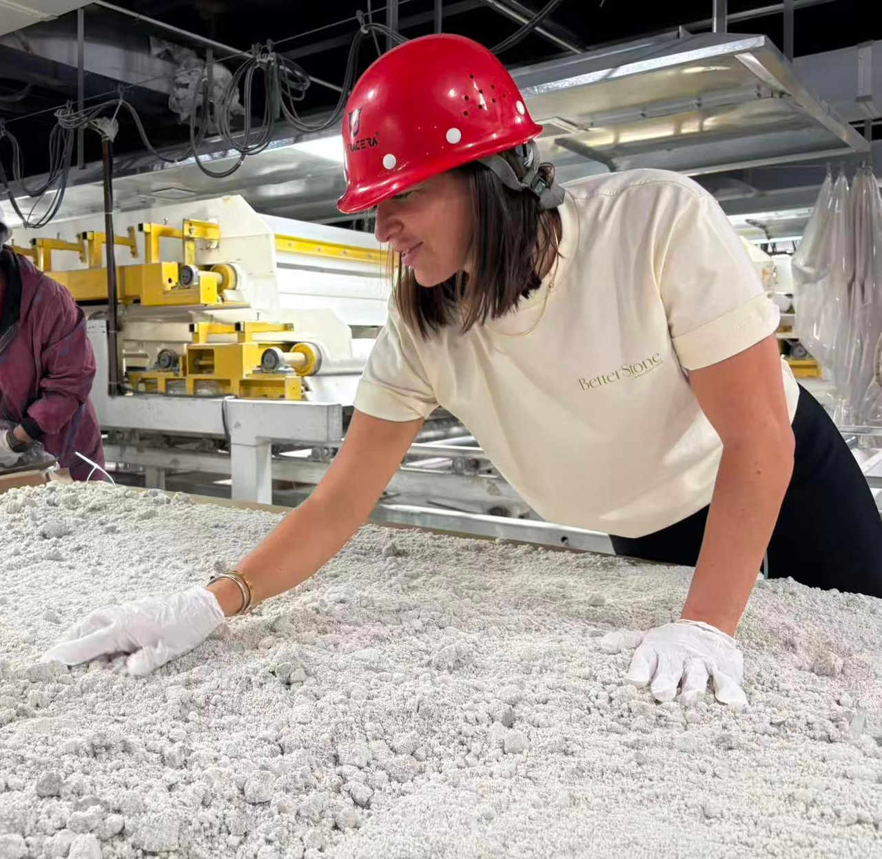 A Person in a Red Hard Hat and White Gloves Examines a Large — Better Stone in Caloundra West, QLD