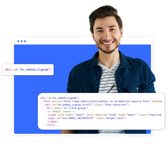 A man with a beard is smiling in front of a blue background.