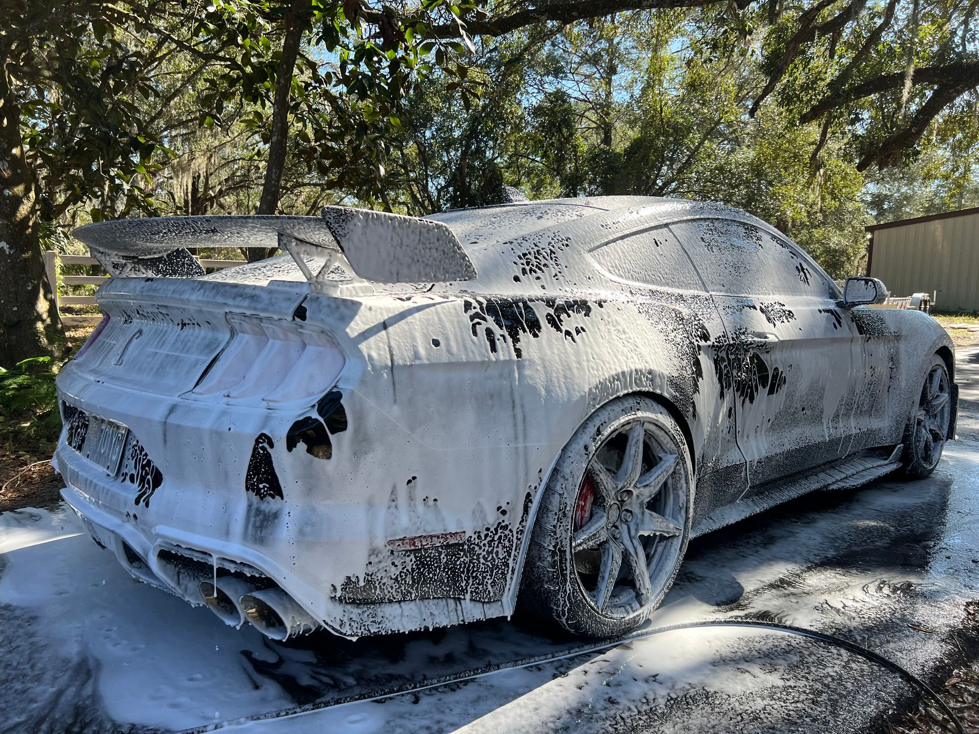 The interior of a car with brown leather seats and a steering wheel.