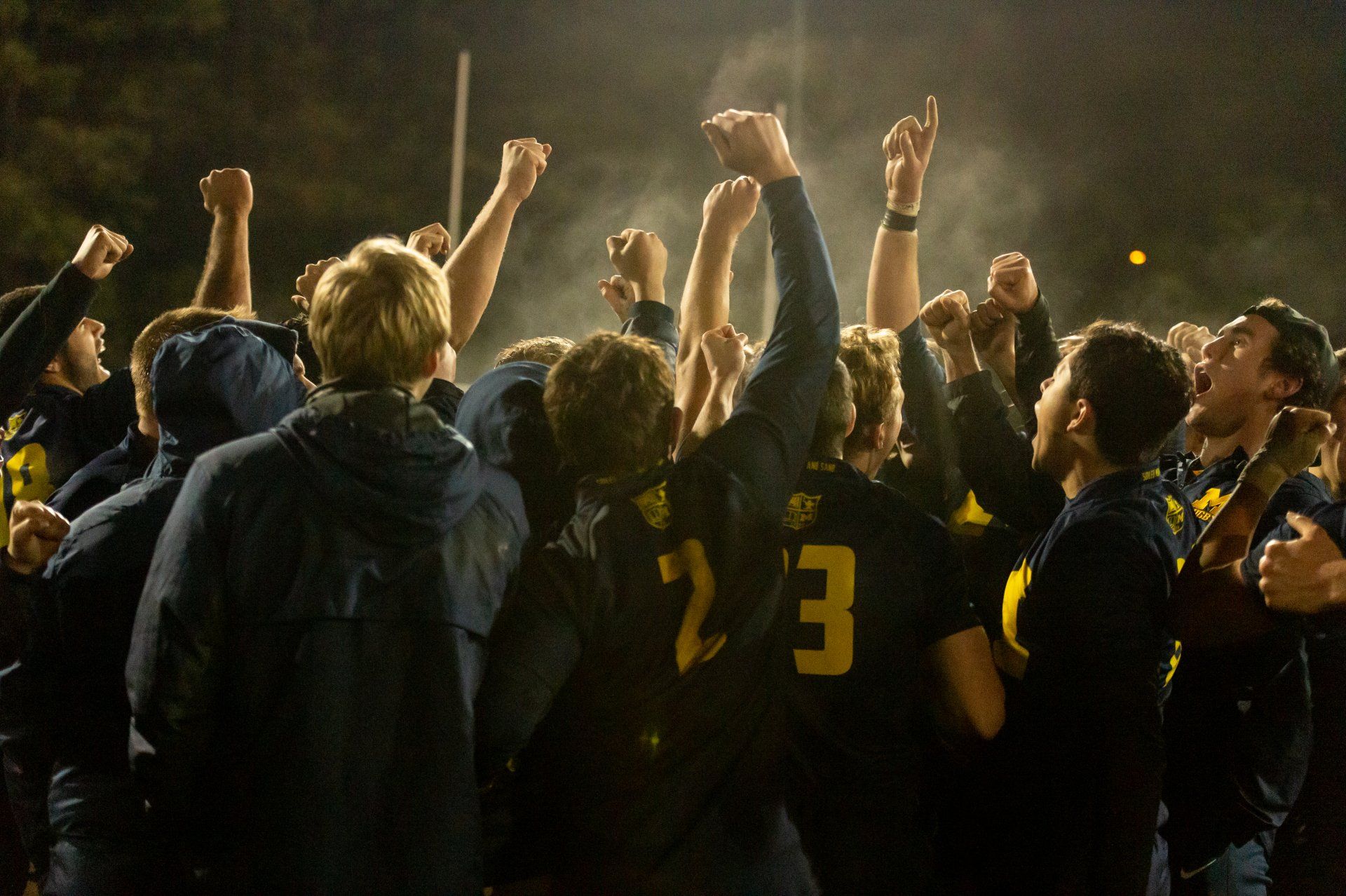 A group of people with one wearing the number 23