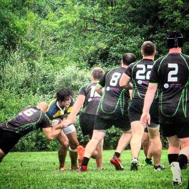 A group of rugby players with the number 2 on their backs