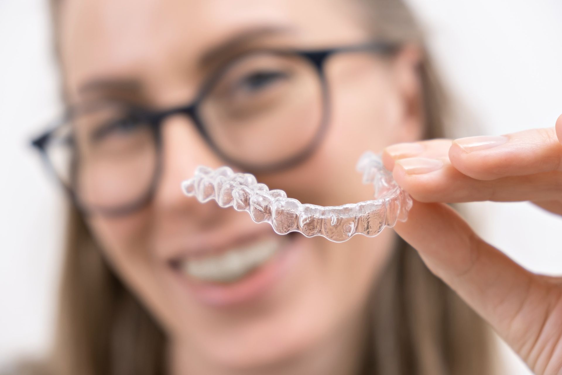 Can Invisalign® Cause Headaches? Royal Dental