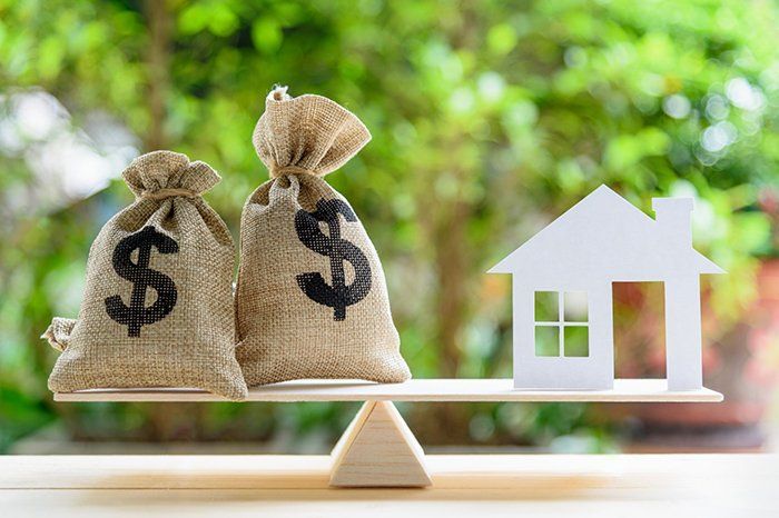 Balancing House And Investment Illustration — Outback Conveyancing Services in Alice Springs, NT