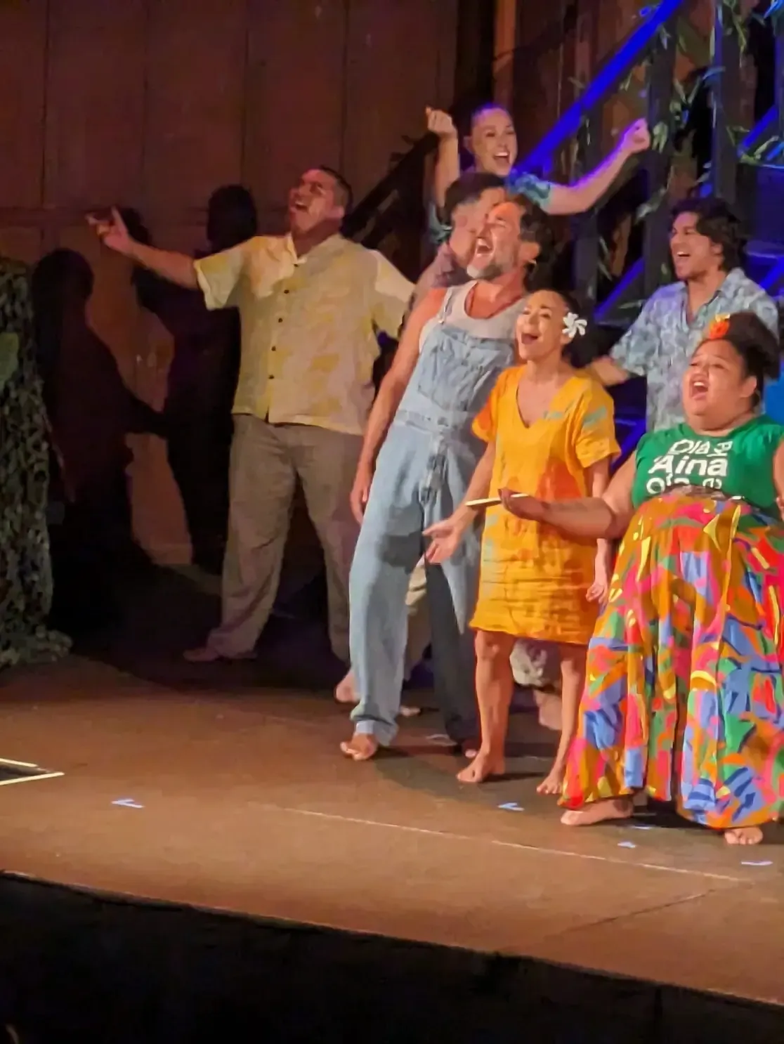 A group of people are standing on a stage.