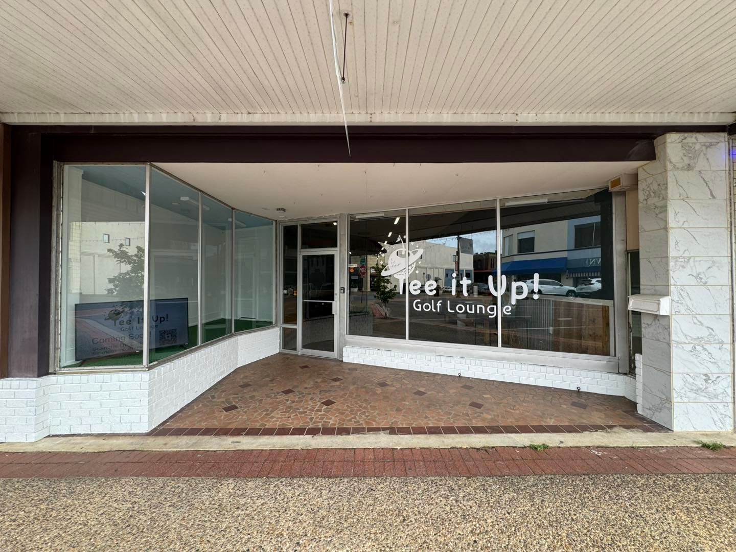 A building with a lot of windows and a sign that says `` let it up ''.