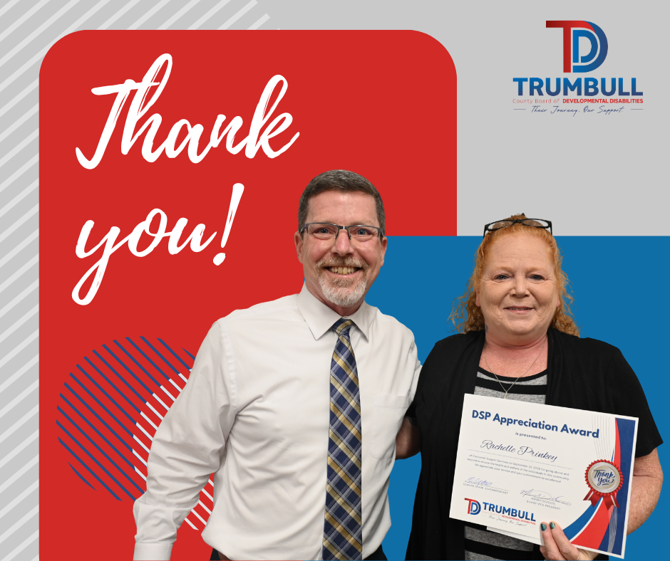 Man and woman with award, red and blue background,
