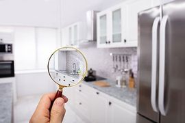 Magnifying glass observing kitchen