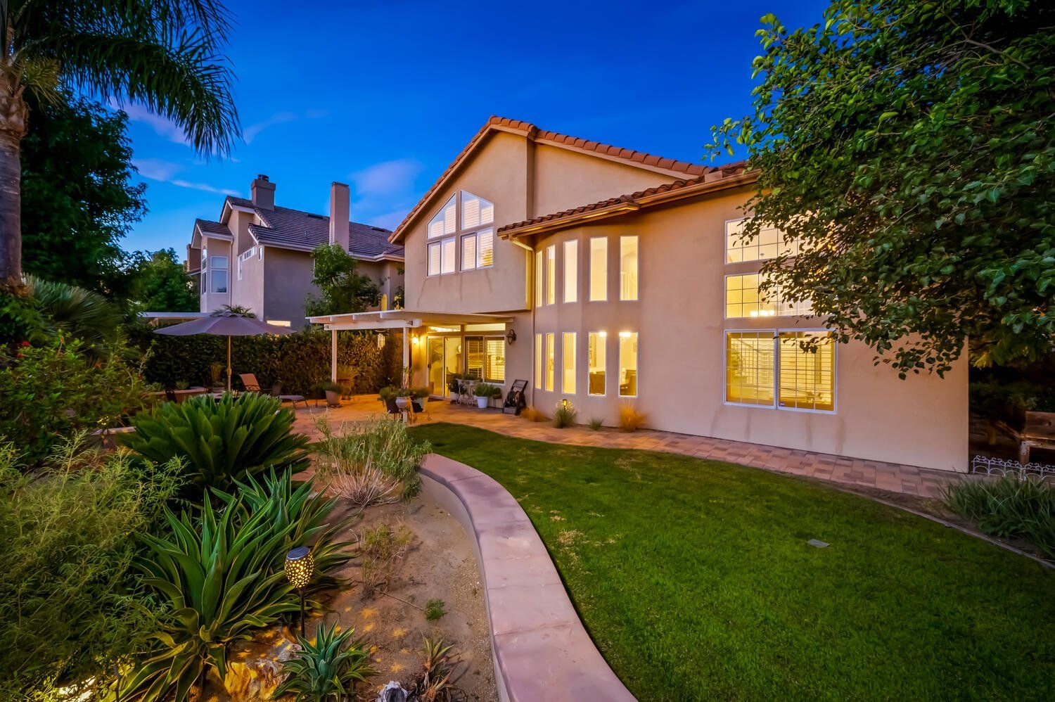 two-story home at night