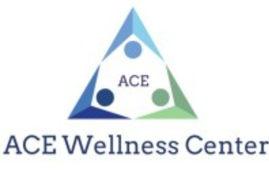 The ace wellness center logo is a triangle with three people inside of it.
