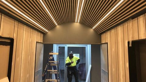 electrician giving thumbs up after lighting installation