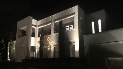 large home with modern exterior lighting