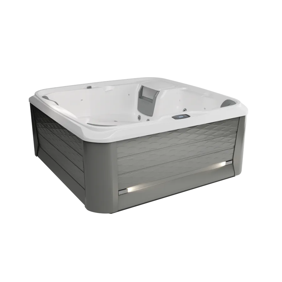 A white and gray hot tub is sitting on a white surface.