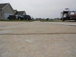 Sidewalk in Champaign, IL before in the process of raising and leveling by a local contractor. Sidewalk in Champaign, IL before in the process of raising and leveling by a local contractor.