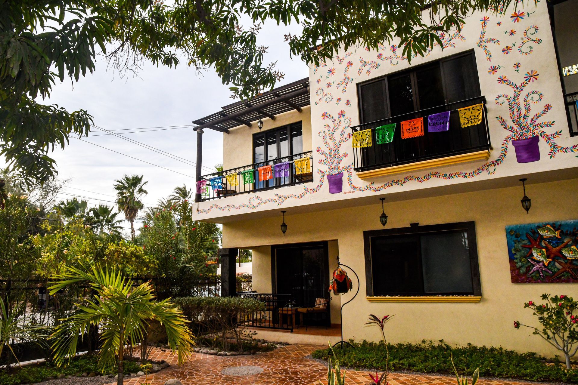 A house with flowers painted on the side of it