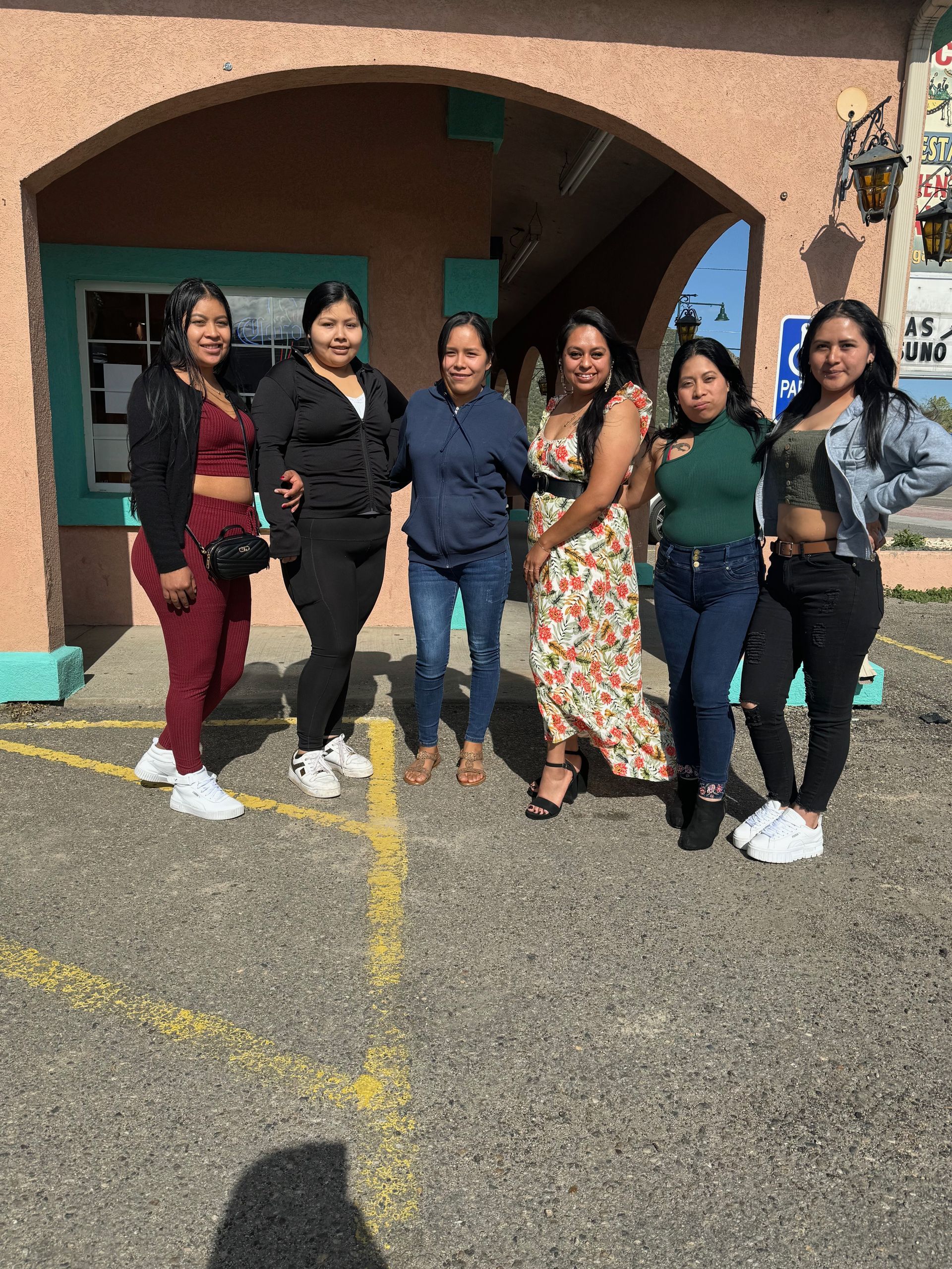 a man in a red aero 1987 shirt stands next to a woman
