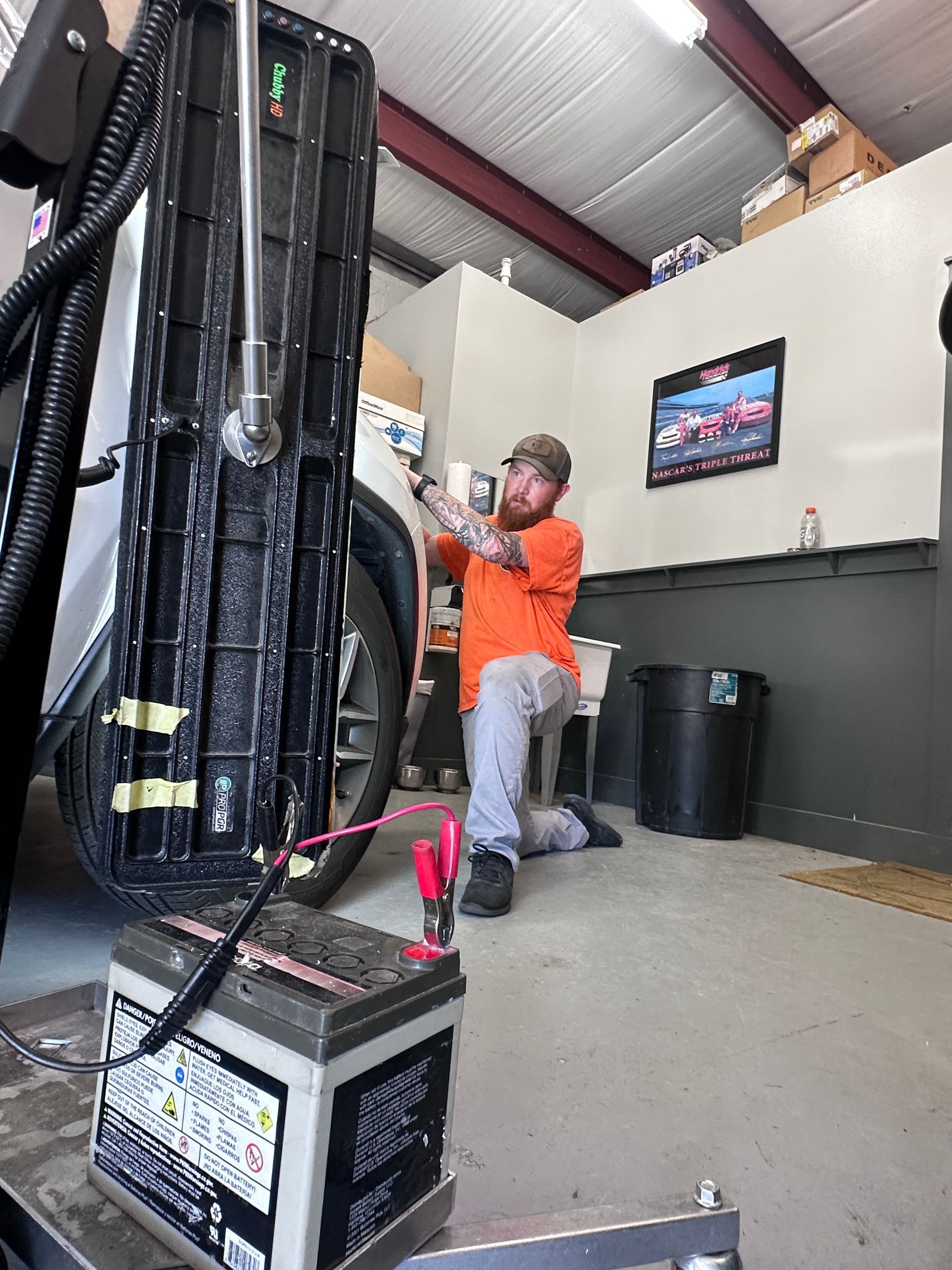 PDR technicians repairing hail damage on vehicles at the Charleston Dent Company in Summerville, SC. Professional auto dent removal in progress. 