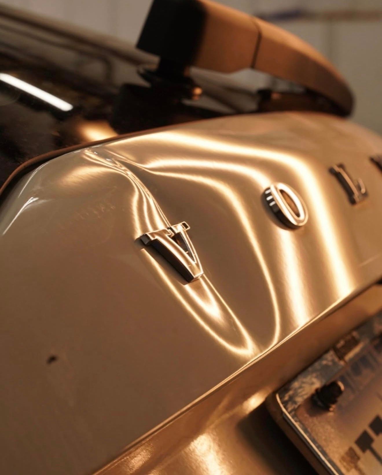 Picture of a Volvo EX90 rear hatch deep dent picture before PDR was performed by Charleston Dent Company technician.. 