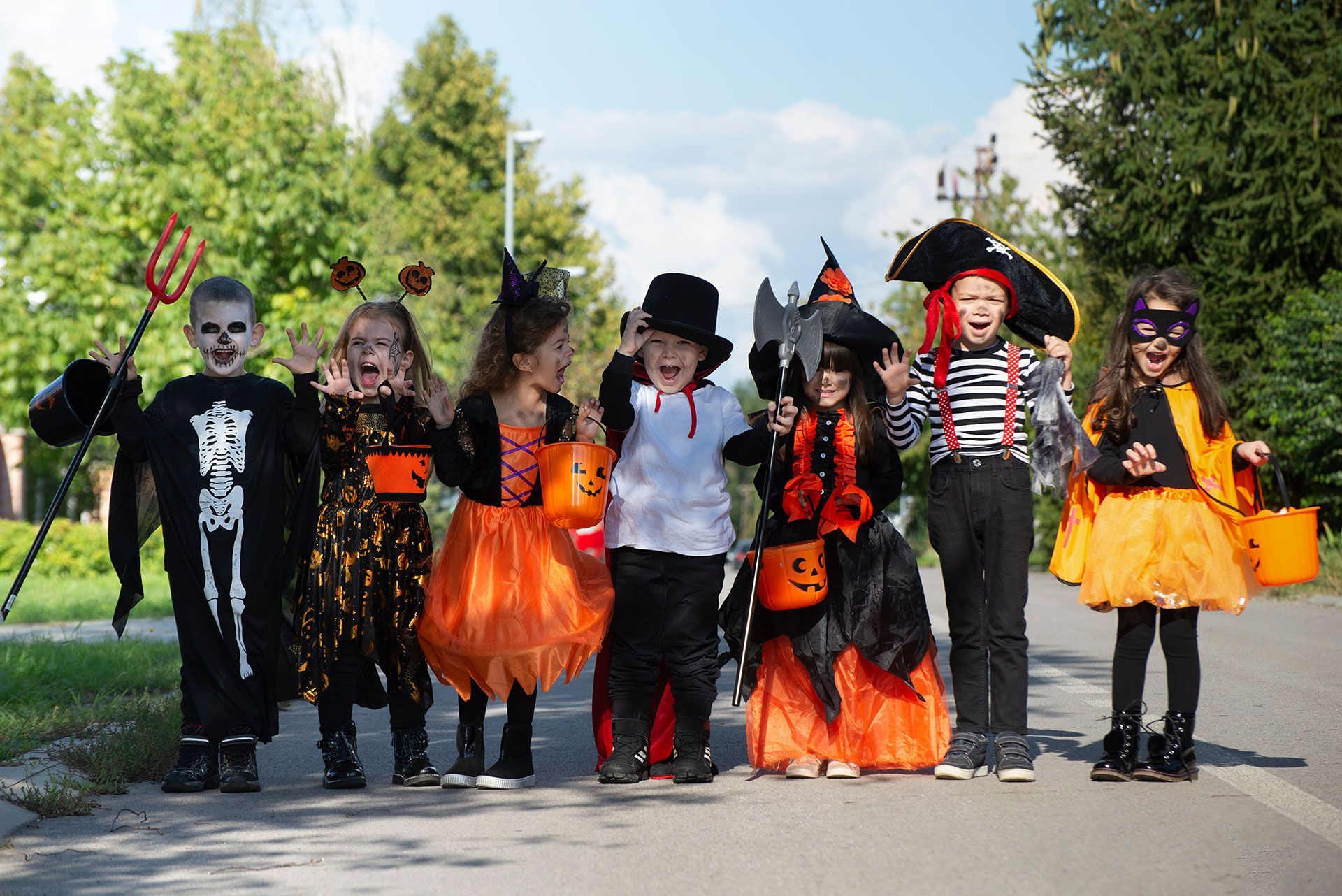 Kids trick or treat. Halloween fun for children.