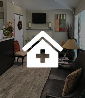 A living room with a couch, chairs, and a television