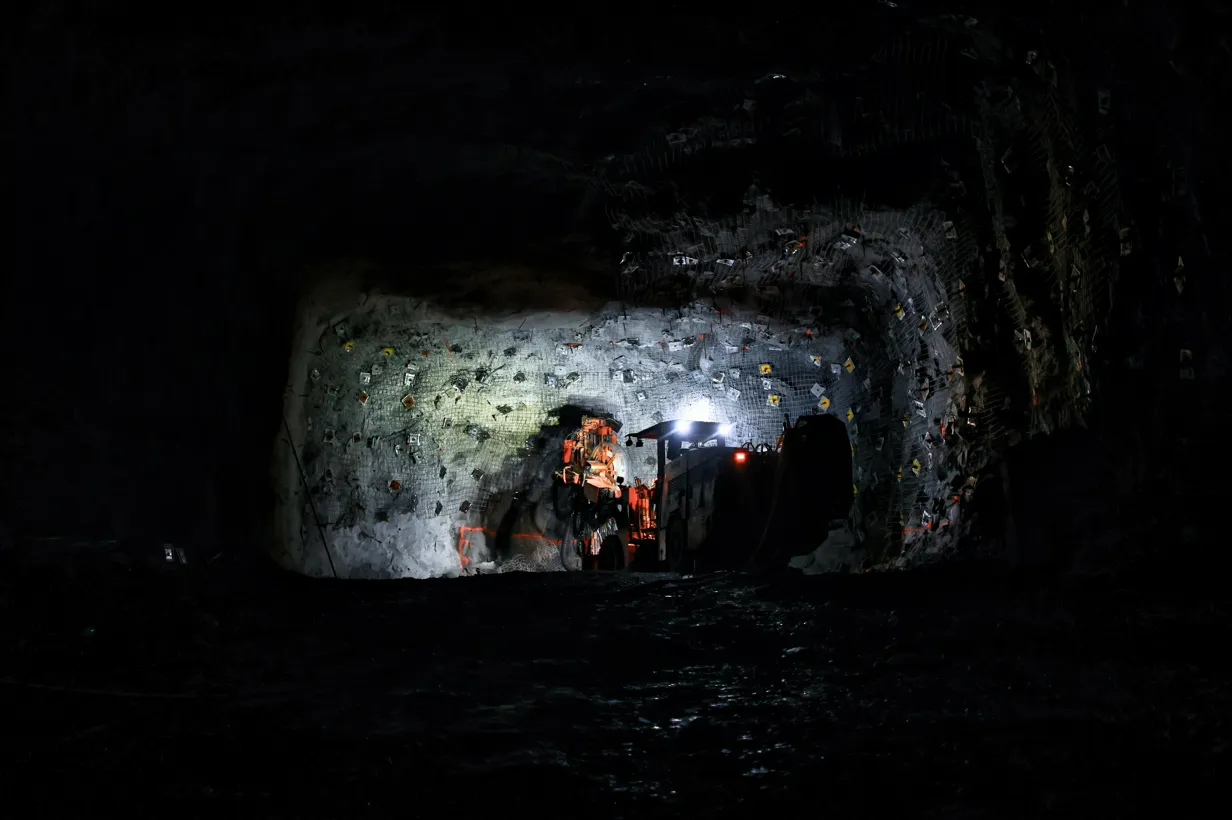 A Coal Mine Interior With Bright Lights — Secure Mine Solutions in Port Ryan, QLD