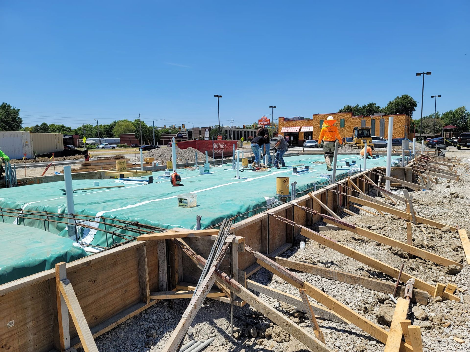 A group of construction workers are working on a building under construction.