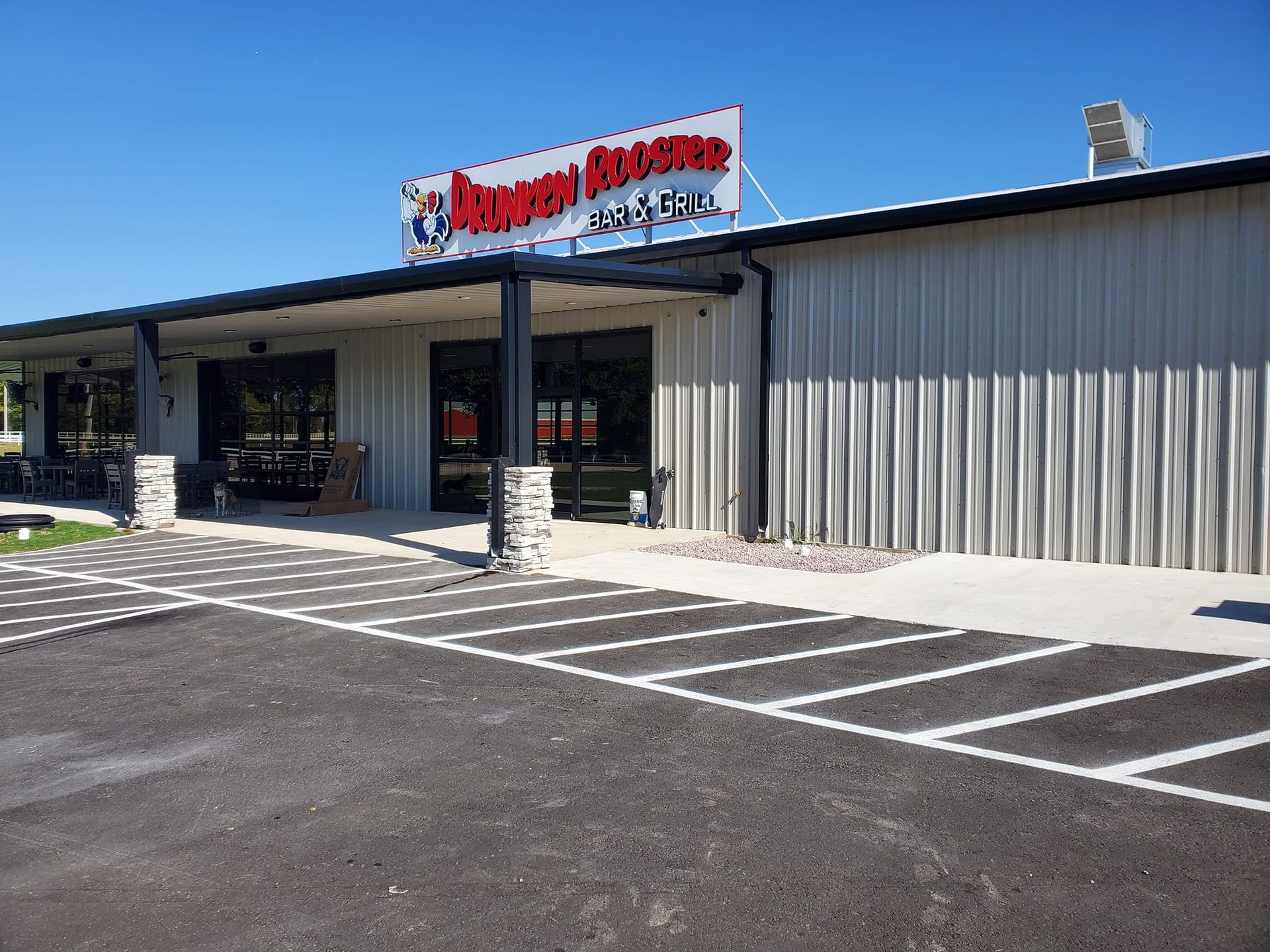 A large building with a parking lot in front of it.