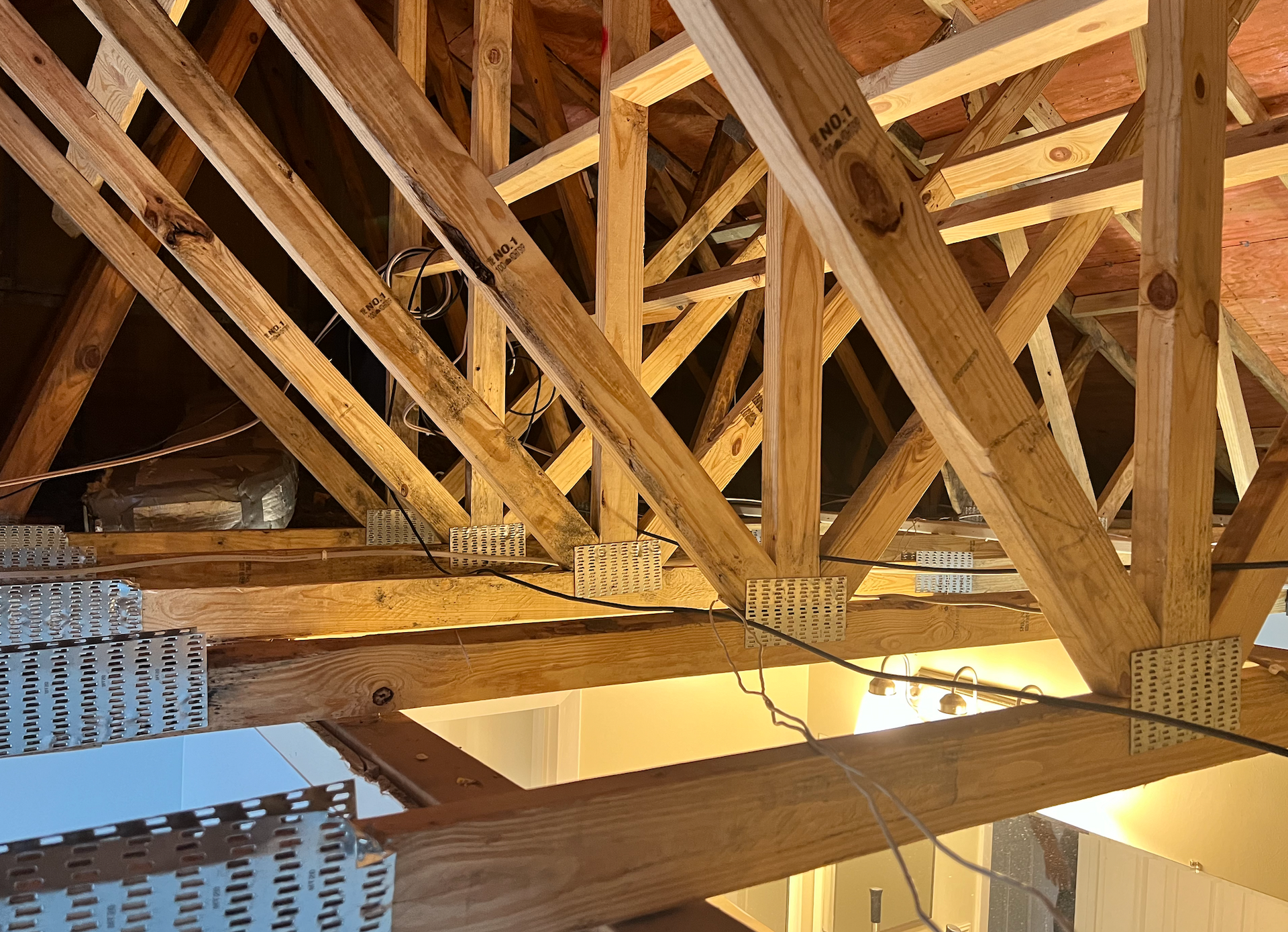 The ceiling of a building is being built with wooden beams