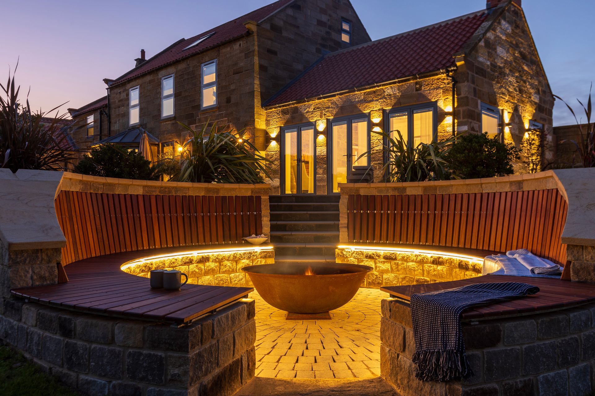 A large stone building with a fountain in front of it.