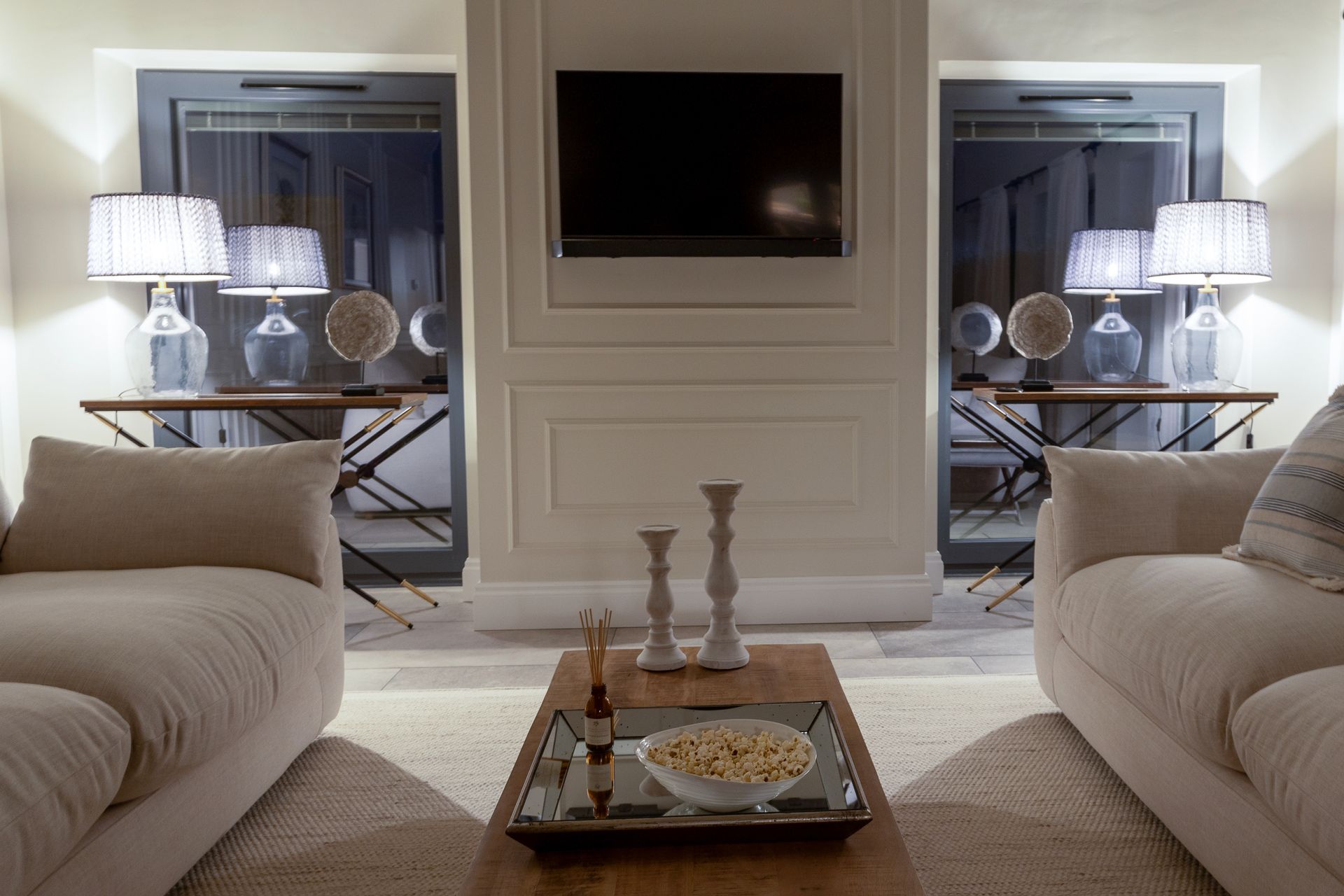 A living room with two couches and a flat screen tv