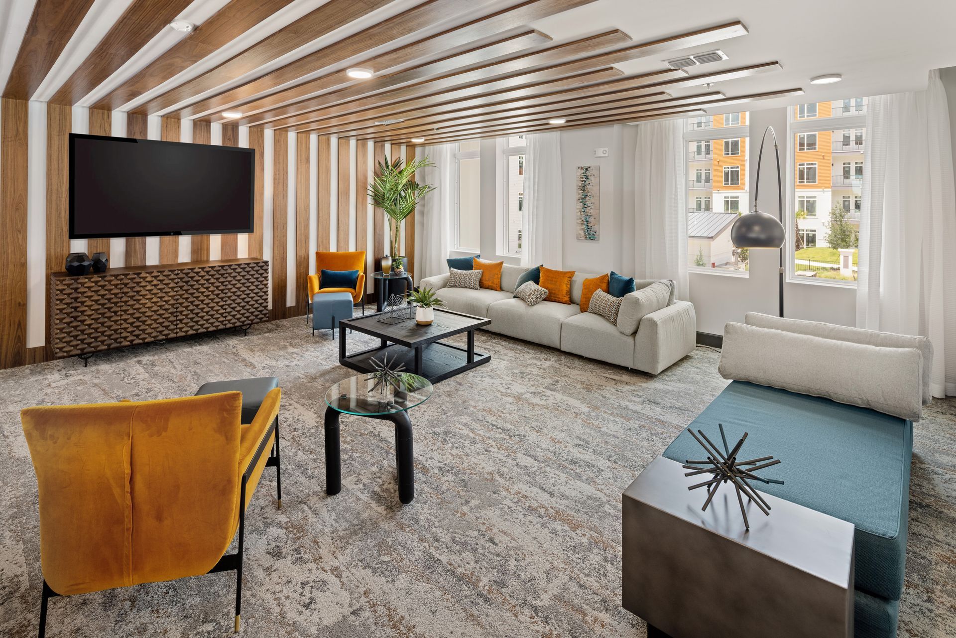 A living room filled with furniture and a flat screen tv.