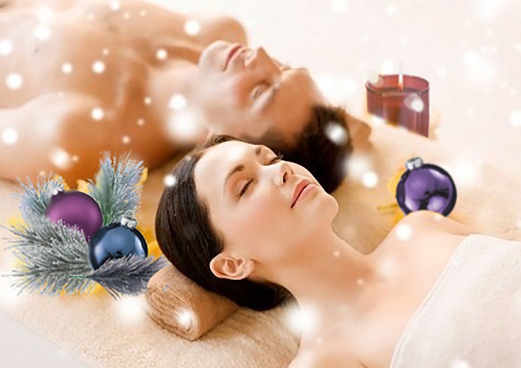 Woman receiving a shoulder massage, eyes closed, with autumn leaves in foreground.