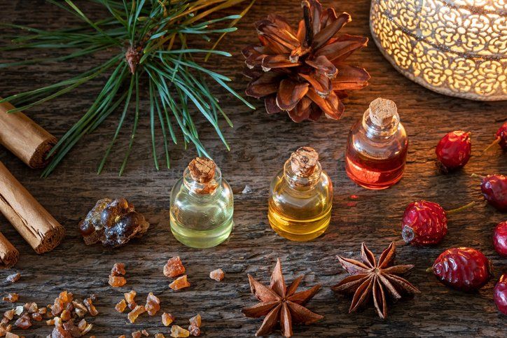 Massage therapy session with essential oils; person getting a back massage.