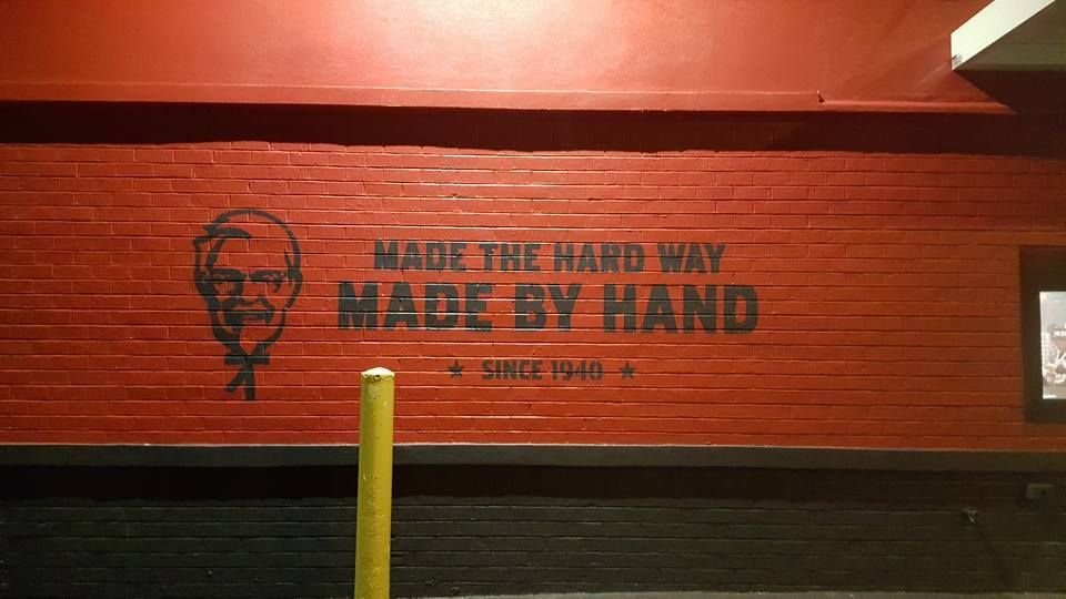 KFC wall with Colonel Sanders, text 