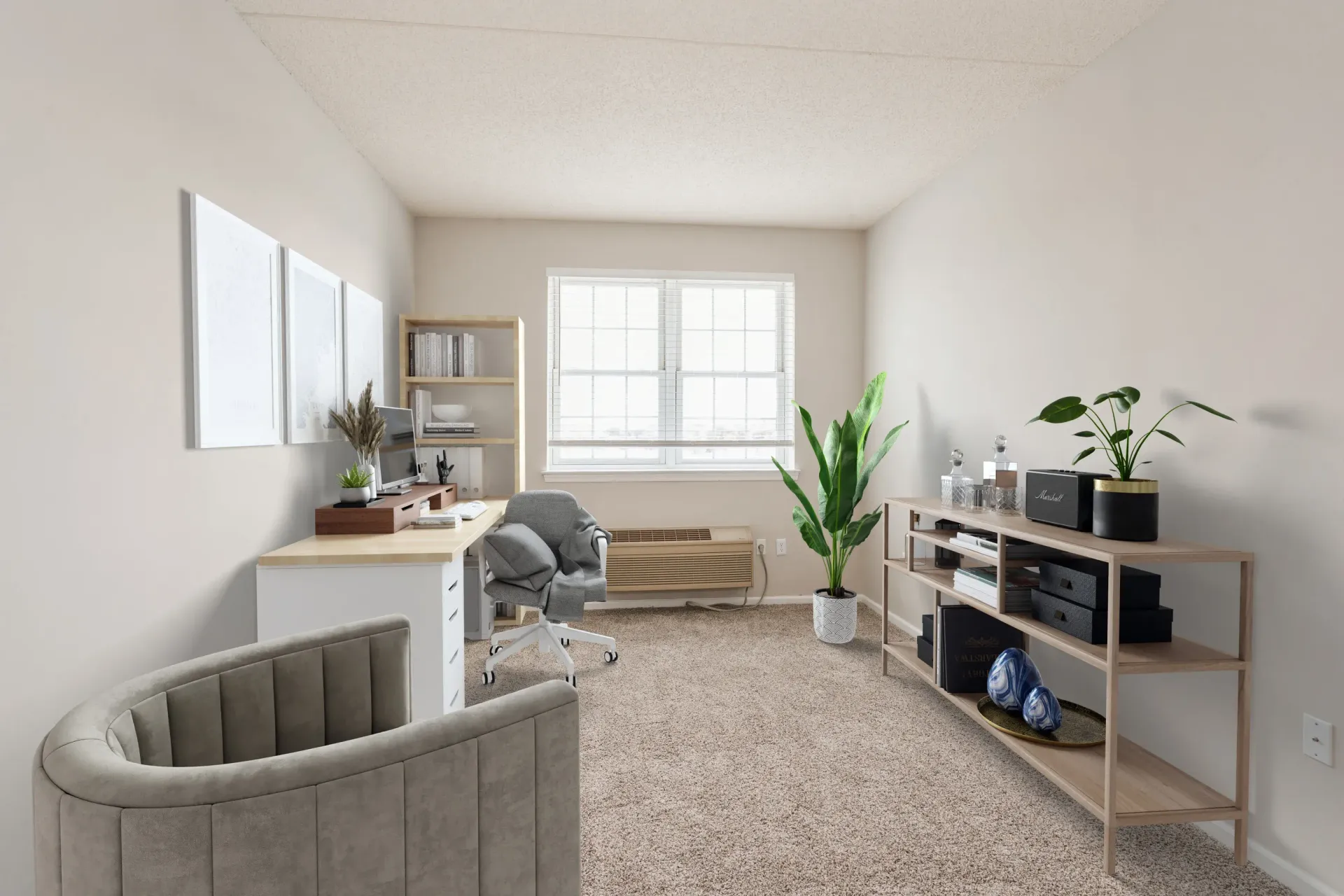 Interior apartment home office with desk, swivel chair, shelves, and a window at Parc at Lyndhurst in Lyndhurst, NJ.