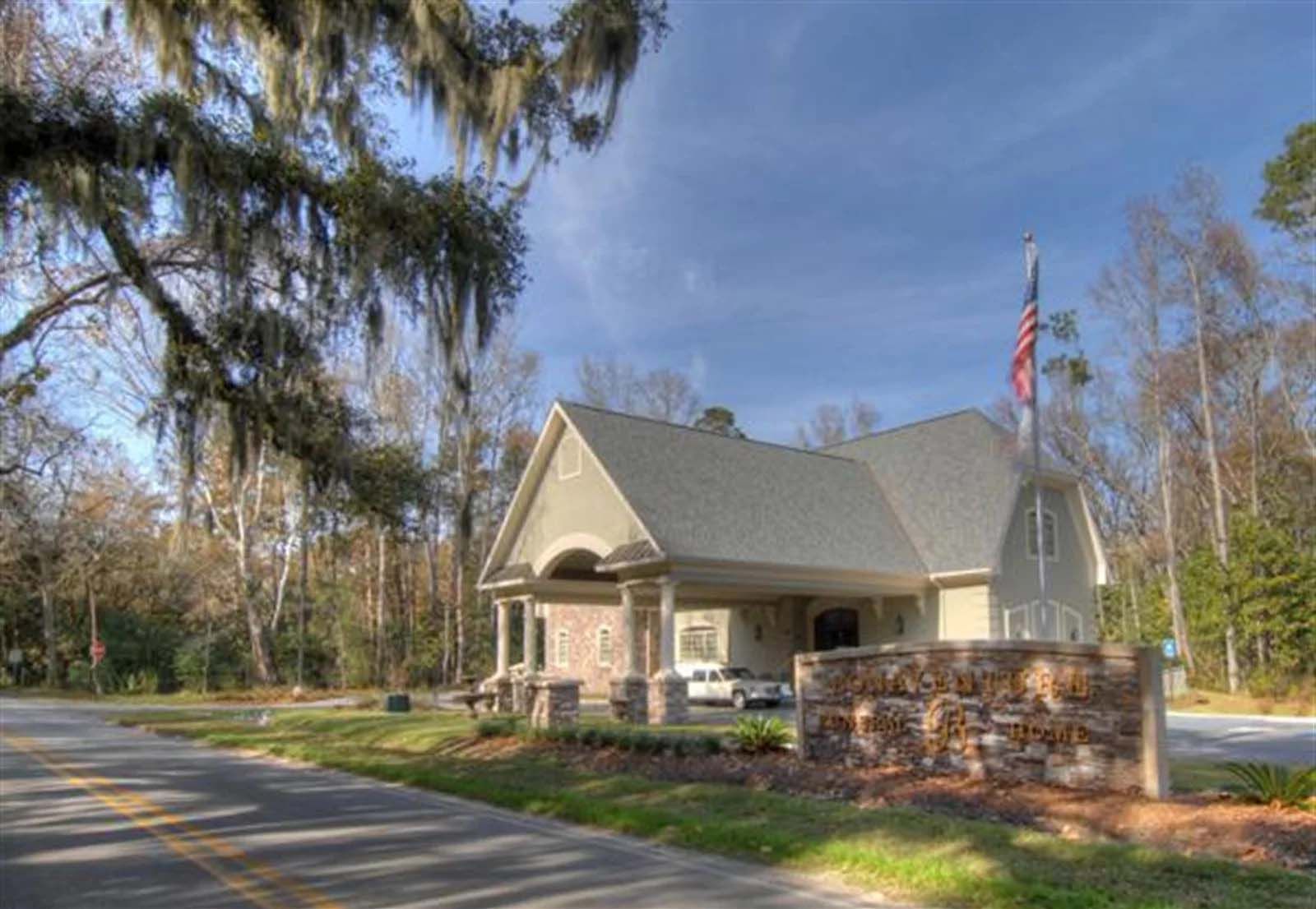 A large house with a flag on the side of it