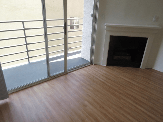 living room with view of balcony and fireplace