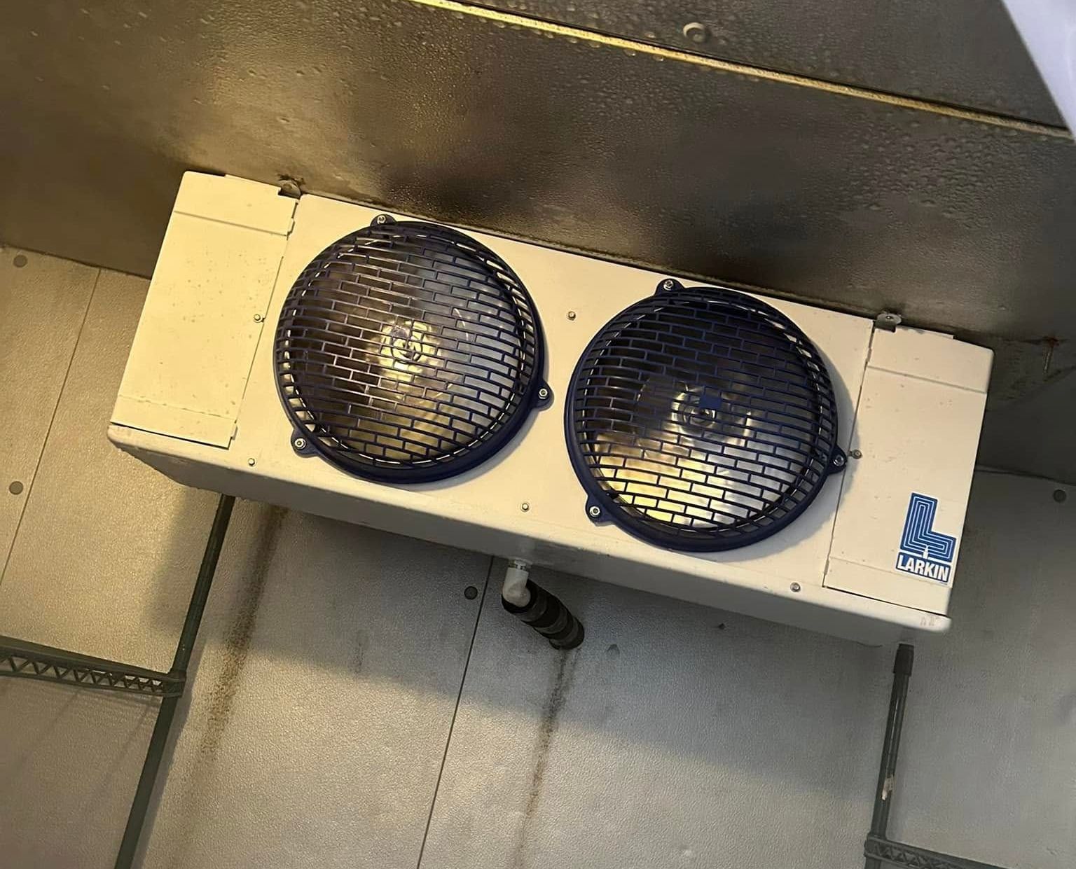 A white box with two speakers on top of it