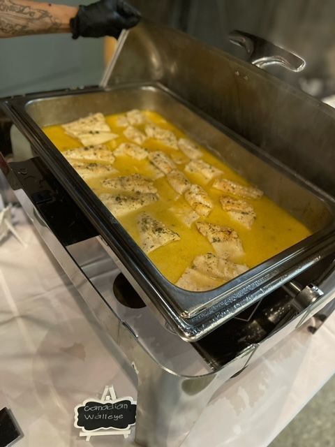 A tray of food with a sign that says ' buffet ' on it