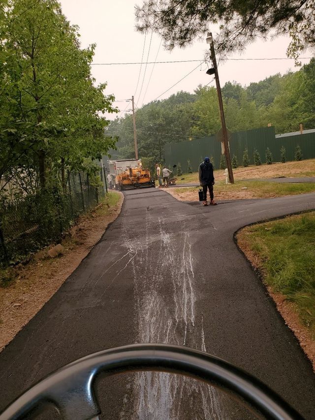 A person is inspecting a newly built road