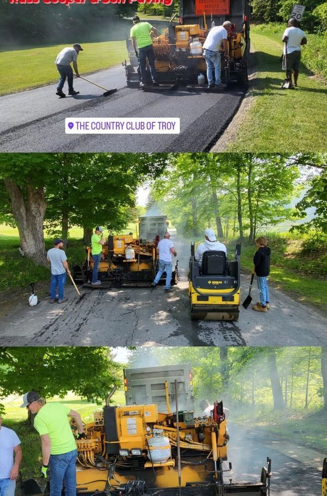A group of people are working on a road.
