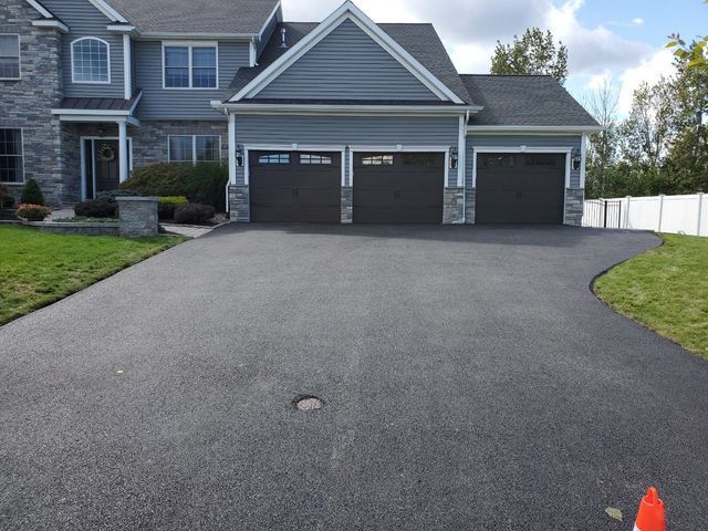 A large house with a driveway leading to it