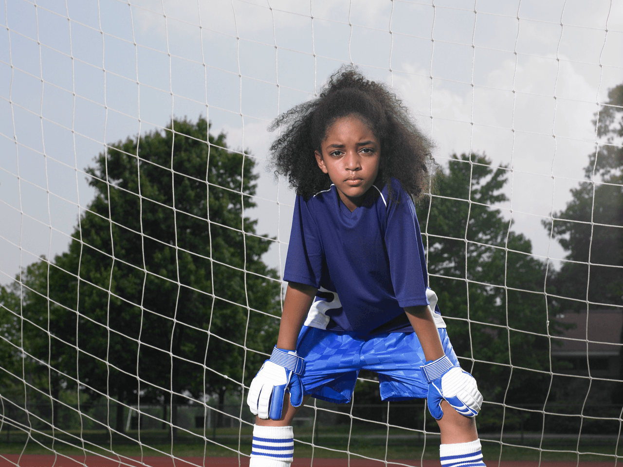 female player posing on the soccer pitch