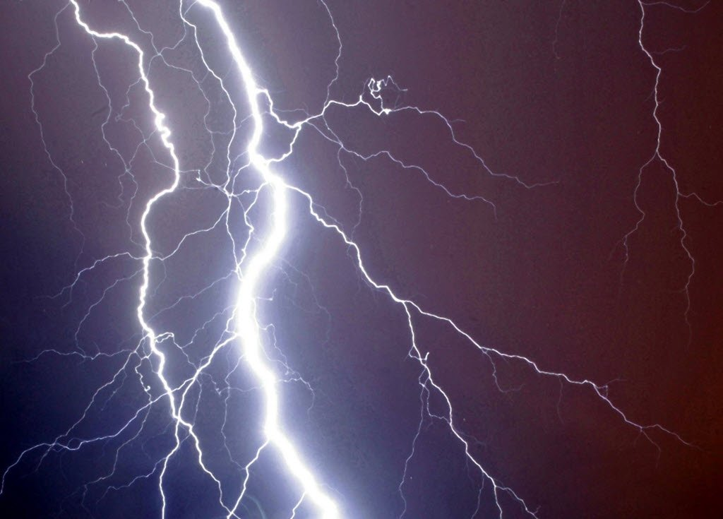 dark sky with lighting striking showing bad weather