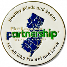 Round pin with the outline of New Jersey and text: 