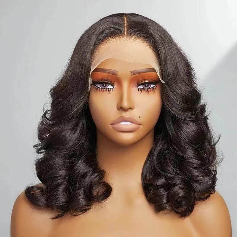 Studio portrait of a mannequin head with long wavy dark hair and dramatic makeup on a neutral background